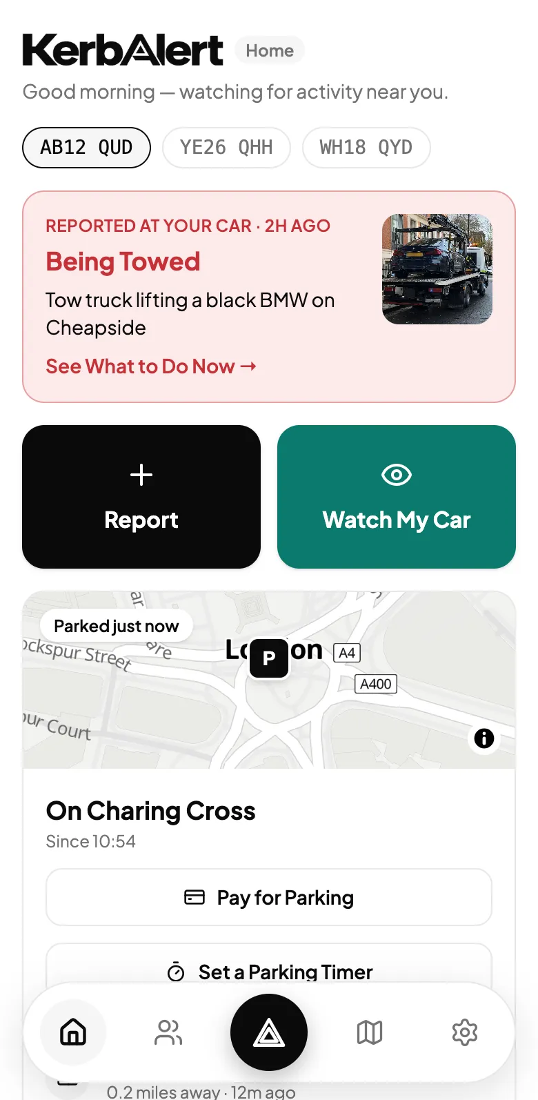 The KerbAlert home screen showing an urgent alert, Being Towed, reported at your car, with the photo and a link to see what to do now.